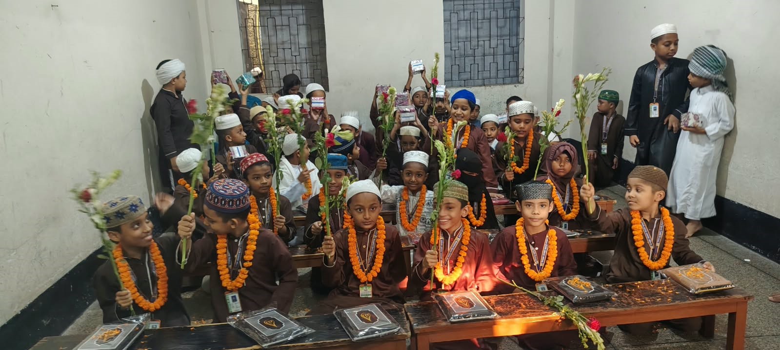 The students of the madrasah are diligently engaging in their Quranic recitation lessons.(26)